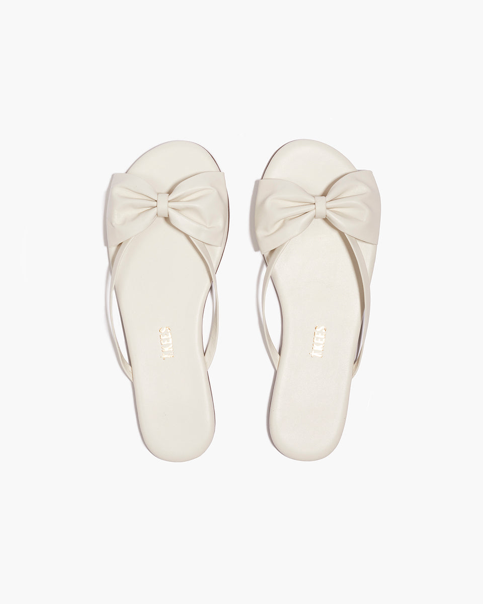 TKEES Lily Oversized Bow Leather Flip Flops in Cream